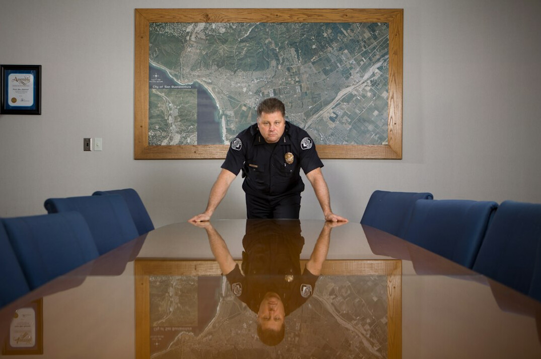 detective talking to staff