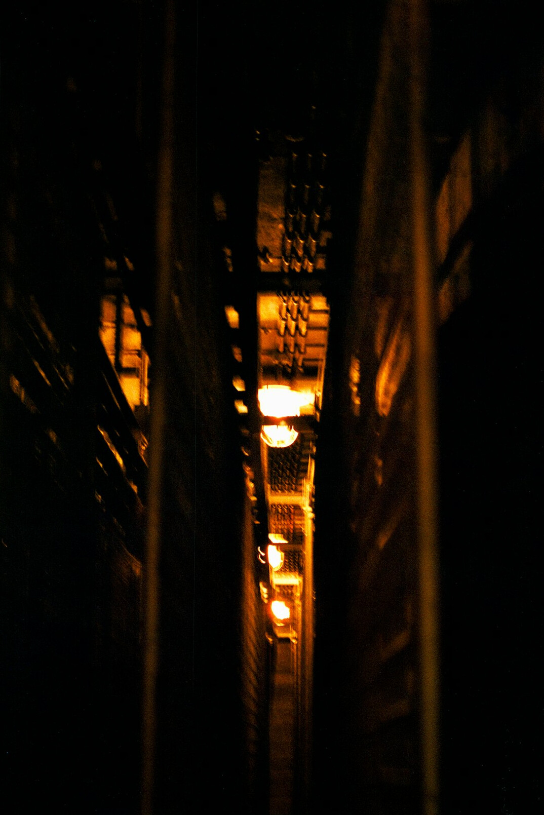 investigator examining boxes in dark warehouse